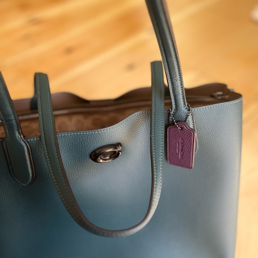 Brand new, never used coach, blue leather shoulder bag.